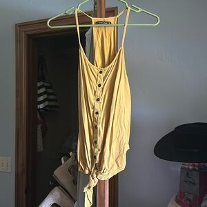 Size large tank. With button and tie front